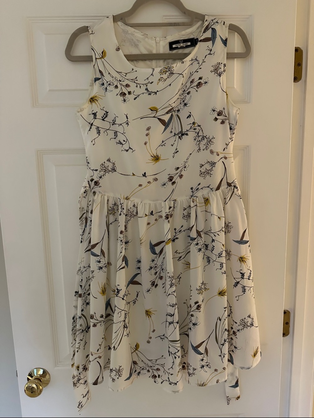 Sleeveless Cream Floral Mini Dress with Blue and Yellow Accents